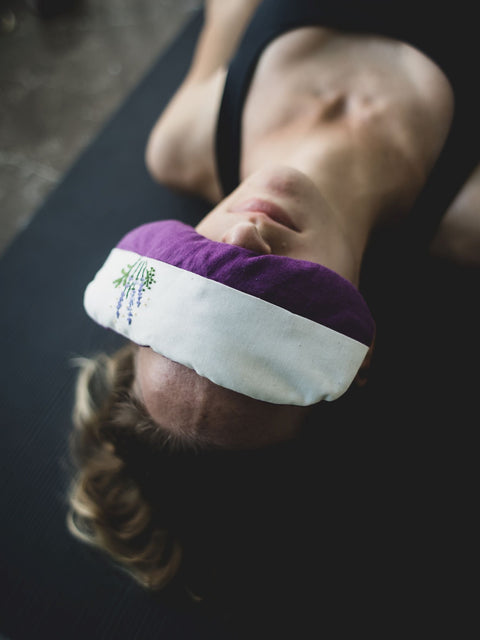 woman relaxing with eye mask